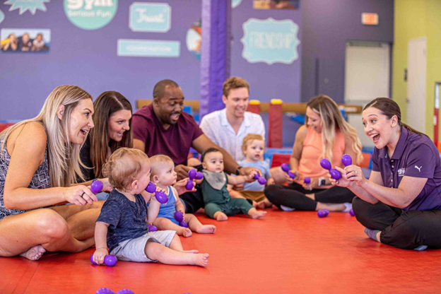 babies sit in a parent-child class at the little gym