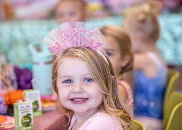 A 3 year old child enjoying her Birthday Party at the Little Gym